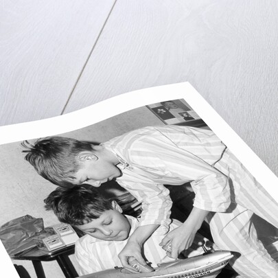 Boys playing with a model plane, c1960s by Tony Boxall