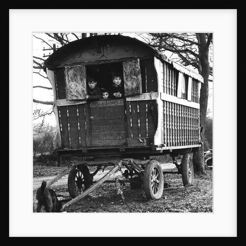 Gipsy children looking out of their caravan by the roadside, Charlwood, Surrey, 1964 by Tony Boxall