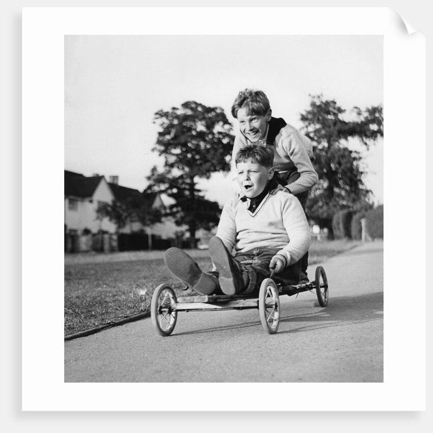 Boys playing with a home-made go-kart, Horley, Surrey, 1965 by Tony Boxall