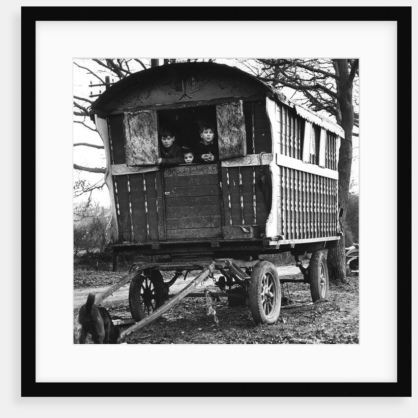 Gipsy children looking out of their caravan by the roadside, Charlwood, Surrey, 1964 by Tony Boxall