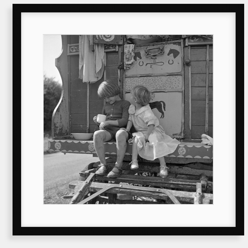 Children sitting on the steps of a gipsy caravan, Outwood, Surrey, 1963 by Tony Boxall