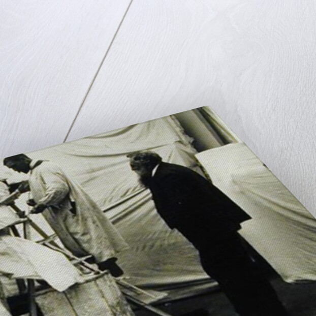 Auguste Rodin in his Paris studio watching the construction of a sculpture, 1905 by Anonymous