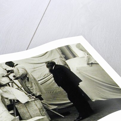 Auguste Rodin in his Paris studio watching the construction of a sculpture, 1905 by Anonymous