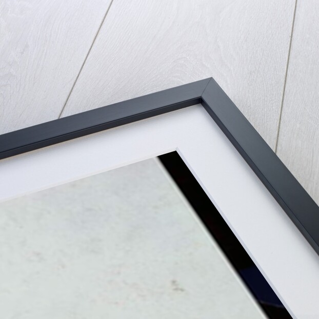 Man sitting upon rocks smoking a pipe by Harry Watson