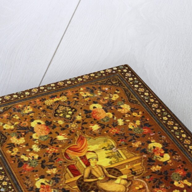 A Zand book cover painted with a central seated figure within an interior, surrounded by floral sprays by Persian School