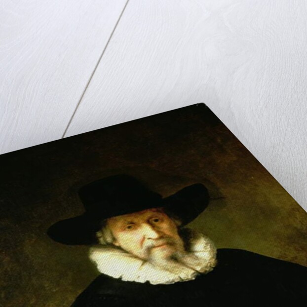 Portrait of a Gentleman wearing a ruff and dark clothes with a wide brimmed hat by Ferdinand Bol