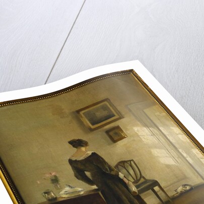 An Interior with a Woman feeding a Cat by Carl Holsoe