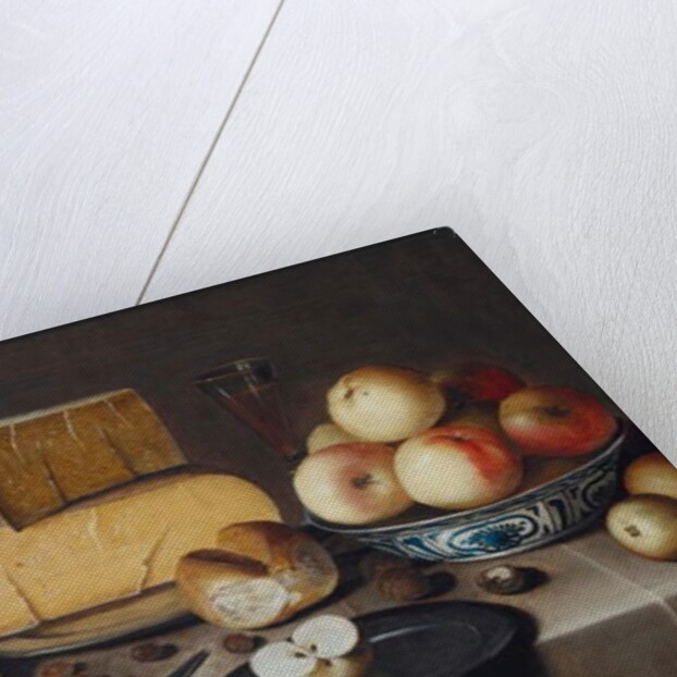 Cheese on a silver plate, red and white grapes and apples in porcelain Wanli bowls, bread rolls, a knife and a sliced apple on a plate, all on a draped table, 1626 by Roloef Koets