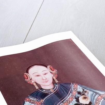 Chinese woman in traditional costume holding a single flower by School Chinese