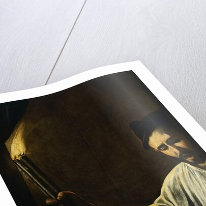 A man holding a torch and burying a dead by Michelangelo Merisi da Caravaggio