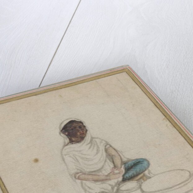 Woman grinding corn by Indian School