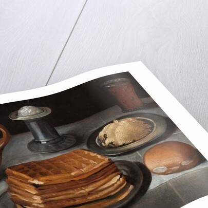 Waffles and butter on pewter plates with an apple, roll, jug, standing salt, and a beer glass with prunts on a cloth-covered table by German School