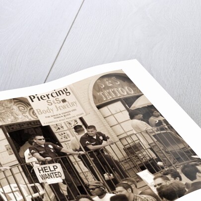 Police gathered behind a 'Help Wanted' sign, 2004 by Stephen Spiller