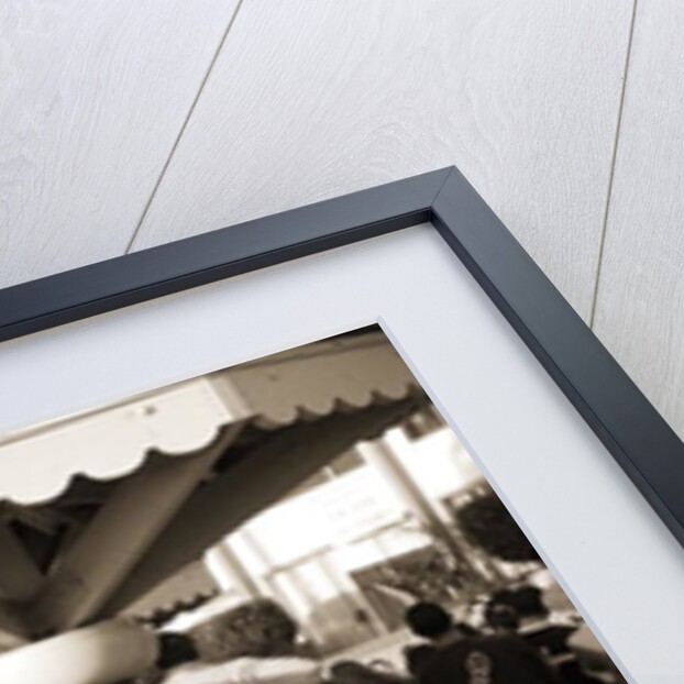 Woman with a pierced tongue applying lipstick, 2004 by Stephen Spiller