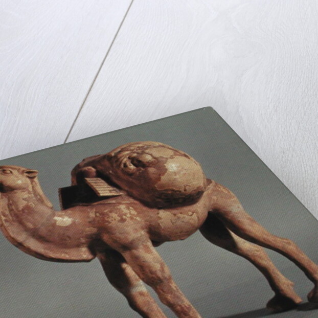 Funerary statuettes of a laden camel and a barbarian caravanner, Tang Dynasty by School Chinese