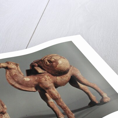 Funerary statuettes of a laden camel and a barbarian caravanner, Tang Dynasty by School Chinese