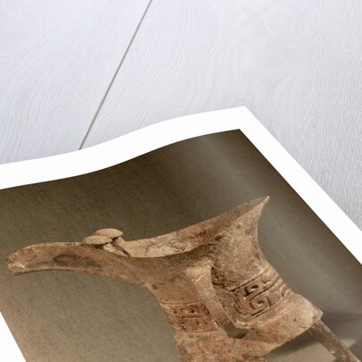 Three-legged 'chueh' vessel for heating wine with a taotie design by School Chinese