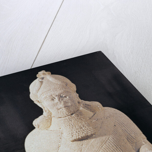 Statuette of a man carrying a box by Assyrian