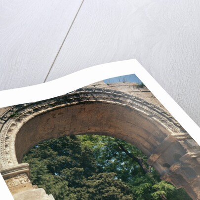 View of the Allee de Sarcophages through the remains of the entrance of the Church of St. Cesaire le Vieux by Anonymous