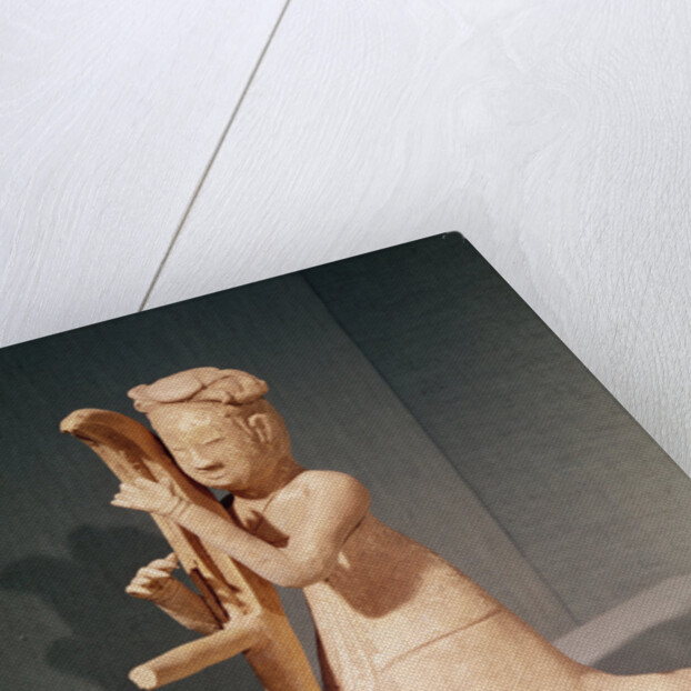 Seated musician playing a harp by Sui Dynasty Chinese School