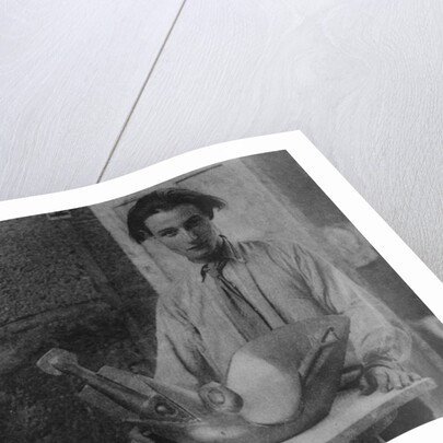 Henri Gaudier-Brzeska with his sculpture 'Bird Swallowing Fish' in Kettle's Yard, University of Cambridge, 1914 by English Photographer