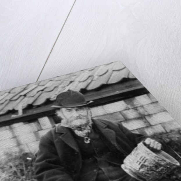 Edward Bingham holding one of his Castle Hedingham Ware designs by English Photographer