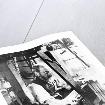 Man working at a handloom by English Photographer
