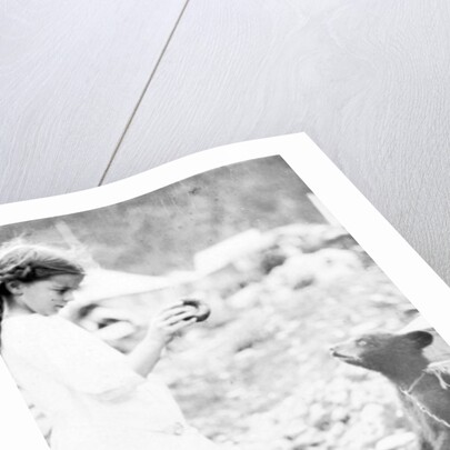 Girl and bear cub, c.1900-16 by Anonymous