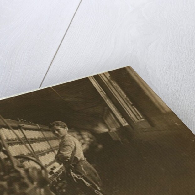 John Dempsey, 11 or 12 years old, Saturday worker in the mule-spinning room at Jackson Mill, Fiskeville, Rhode Island, 1909 by Lewis Wickes Hine