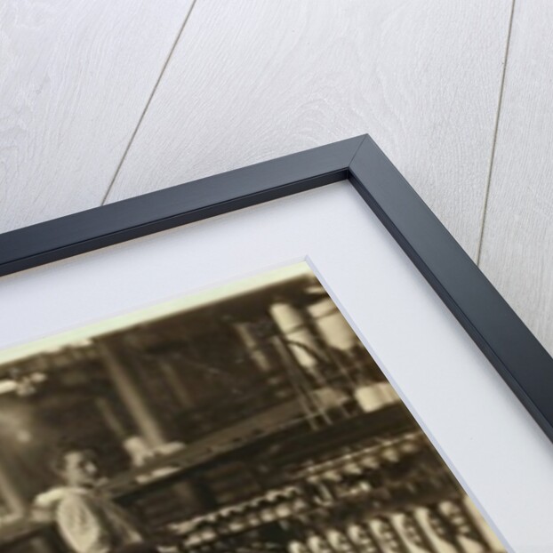 8 year old Leo, only 4 feet tall, picks up bobbins for 15 cents a day at Elk Cotton Mills, Fayetteville, Tennessee, 1910 by Lewis Wickes Hine