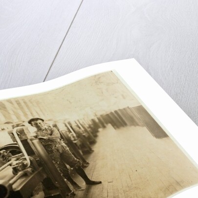 Boy sweeper by carding machines at Lincoln Cotton Mills, Evansville, Indiana in stockinged feet on a slippery floor, 1908 by Lewis Wickes Hine