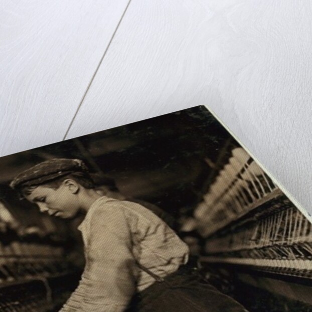 A doffer replaces full bobbins at Globe Cotton Mill, Augusta, Georgia, 1909 by Lewis Wickes Hine