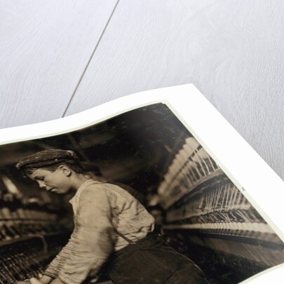 A doffer replaces full bobbins at Globe Cotton Mill, Augusta, Georgia, 1909 by Lewis Wickes Hine