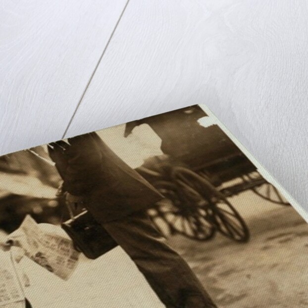 6 year old newsboy Hyman selling papers until 6 p.m. in Lawrence, Massachusetts, 1911 by Lewis Wickes Hine