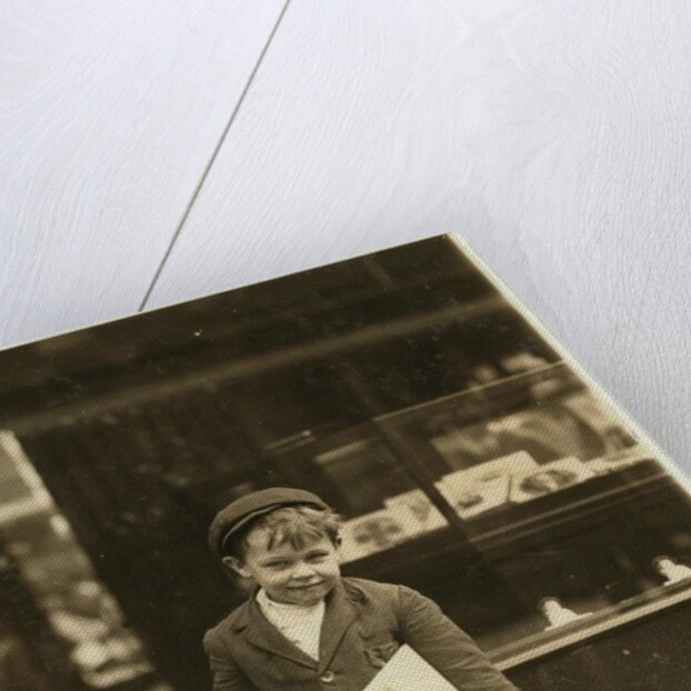 5 year old newsboy Tommy Hawkins only 3 ft 4 ins tall, working in St. Louis, Missouri, 1910 by Lewis Wickes Hine