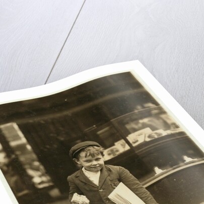 5 year old newsboy Tommy Hawkins only 3 ft 4 ins tall, working in St. Louis, Missouri, 1910 by Lewis Wickes Hine