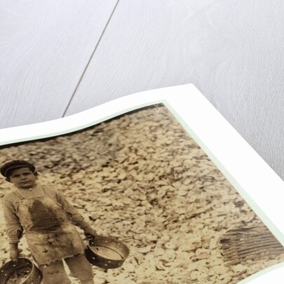 5 year old migrant shrimp-picker Manuel in front of a pile of oyster shells by Lewis Wickes Hine