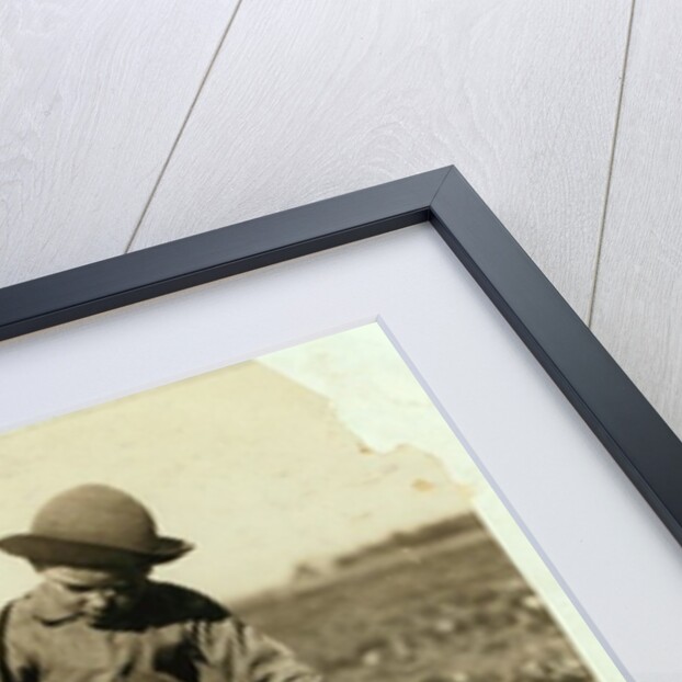 Alex Reiber aged 7 carries on topping sugar beets after 'hooking' his knee, near Sterling, Colorado, 1915 by Lewis Wickes Hine