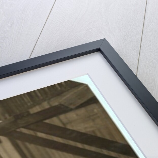 Charlie McBride aged 12 takes wood from a chute for 10 hours at Miller & Vidor Lumber Company, Beaumont, Texas by Lewis Wickes Hine