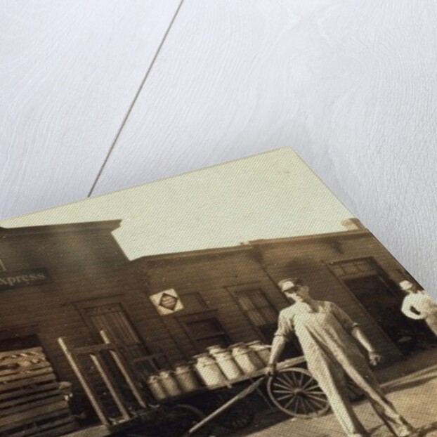 Men in front of a Wells Fargo & Co Express depot with crates and milk cans, Springfiled, Missouri, 1916 by Lewis Wickes Hine