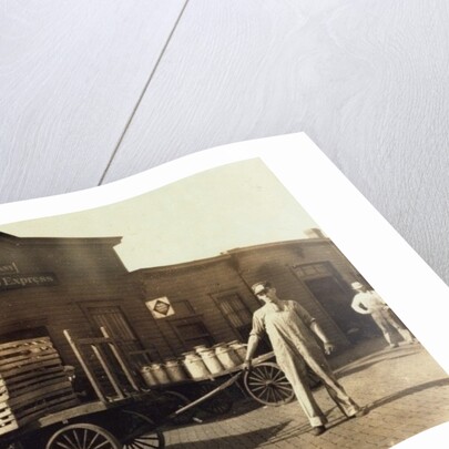 Men in front of a Wells Fargo & Co Express depot with crates and milk cans, Springfiled, Missouri, 1916 by Lewis Wickes Hine