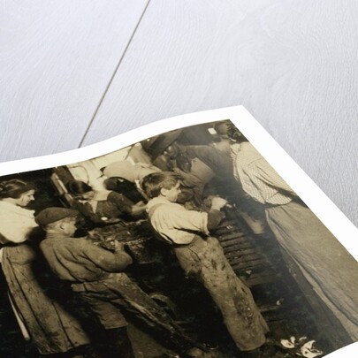 10 year old Jimmie who has been shucking 3 years with an 11 year old boy who shucks 7 pots by Lewis Wickes Hine