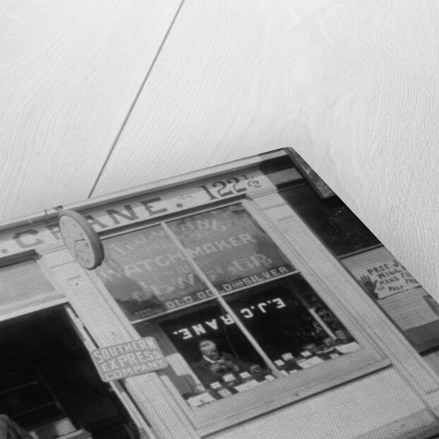 E.J. Crane, watchmaker and jewelry store, c.1899 by American Photographer