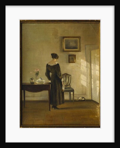An Interior with a Woman feeding a Cat by Carl Holsoe