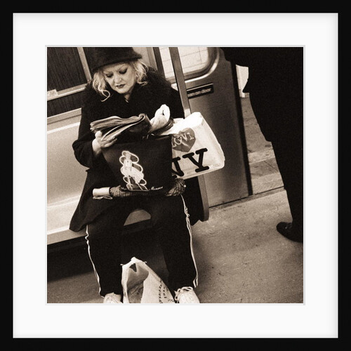 Woman reading on a subway with a Marilyn Monroe purse and an 'I Love New York' bag, 2004 by Anonymous