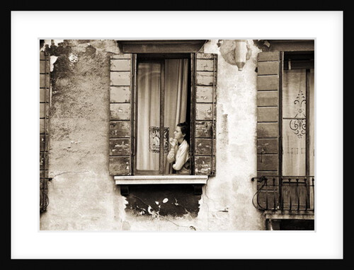 Woman gazing out of a window contemplating, 2004 by Stephen Spiller