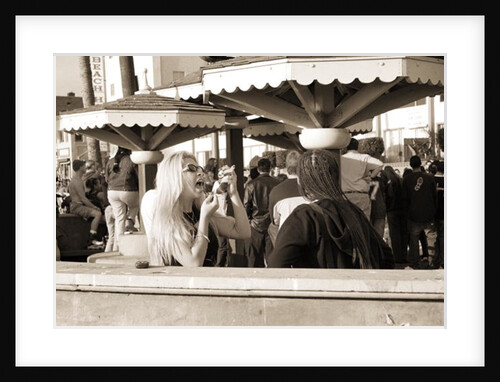 Woman with a pierced tongue applying lipstick, 2004 by Stephen Spiller