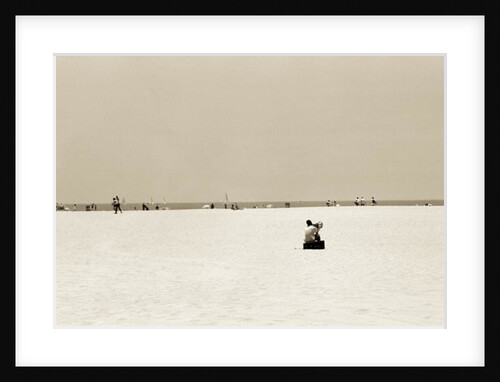 Man sitting on a beach playing his horn, 2004 by Stephen Spiller