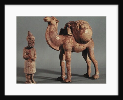 Funerary statuettes of a laden camel and a barbarian caravanner, Tang Dynasty by School Chinese