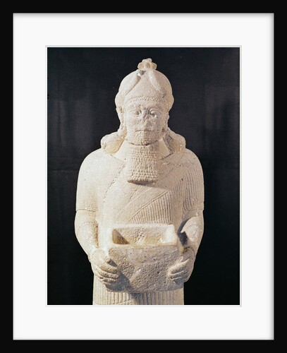 Statuette of a man carrying a box by Assyrian